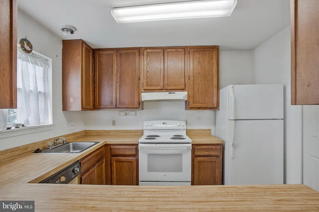 10734 Castleton Way, Upper Marlboro, MD 20774 - kitchen with white appliances, under cabinet range hood, light countertops, and brown cabinetry