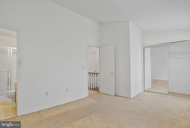 10734 Castleton Way, Upper Marlboro, MD 20774 - unfurnished bedroom featuring carpet flooring, ensuite bath, a closet, and vaulted ceiling