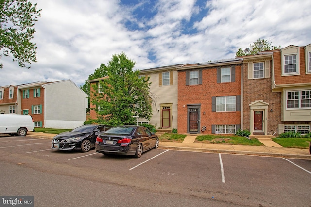 10734 Castleton Way, Upper Marlboro, MD 20774 - view of property with uncovered parking and brick siding