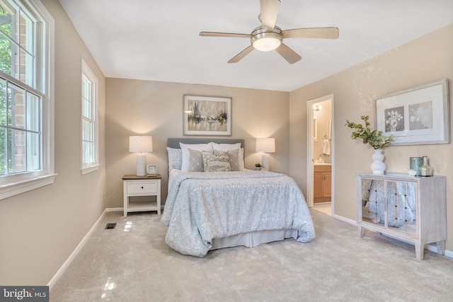 9807 Spillway Ct, Burke, VA 22015 - bedroom featuring light colored carpet, baseboards, connected bathroom, and ceiling fan