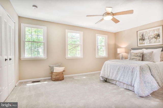 9807 Spillway Ct, Burke, VA 22015 - bedroom featuring baseboards, multiple windows, a closet, and carpet flooring