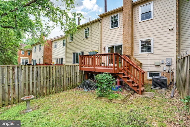 9807 Spillway Ct, Burke, VA 22015 - back of house with central AC unit, a wooden deck, and a garden