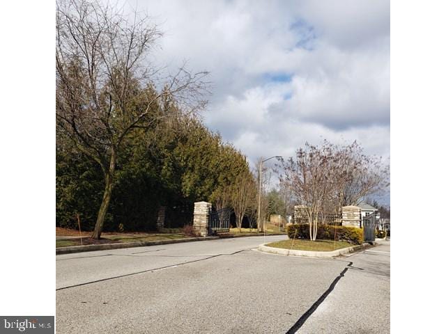 8790 Sage Brush Way Unit 19, Columbia, MD 21045 - view of asphalt road with curbs and street lights