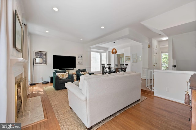 45 Arell Ct, Alexandria, VA 22304 - living room featuring light wood finished floors, healthy amount of natural light, recessed lighting, and a fireplace with flush hearth