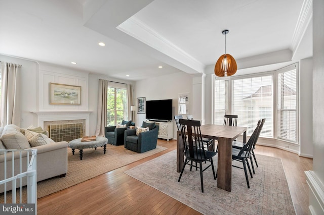 45 Arell Ct, Alexandria, VA 22304 - dining room with crown molding, recessed lighting, wood finished floors, and a tile fireplace