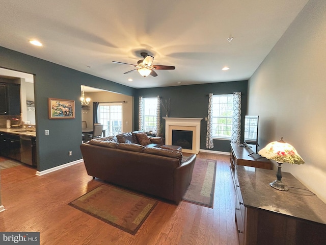 217 Sills Ln, Downingtown, PA 19335 - living room with plenty of natural light, wood finished floors, a ceiling fan, a fireplace, and recessed lighting