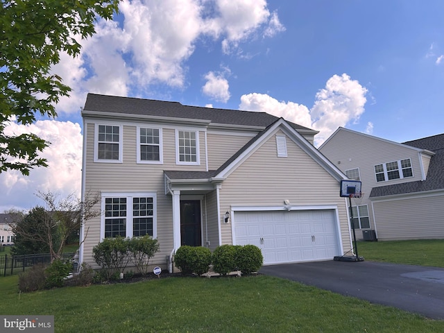 724 N Haines Cir, Downingtown, PA 19335 - traditional-style home featuring asphalt driveway, an attached garage, and cooling unit
