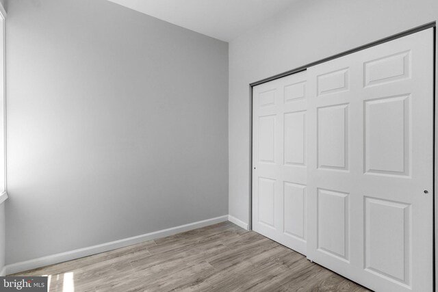 1906 Durfor St, Philadelphia, PA 19145 - unfurnished bedroom featuring wood finished floors, a closet, and baseboards
