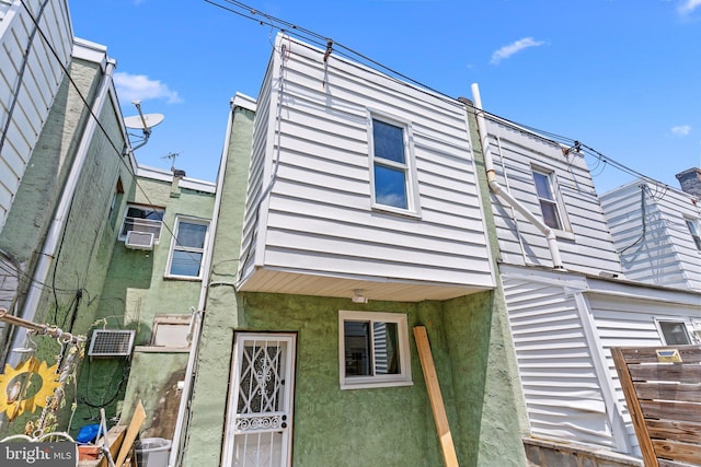 1906 Durfor St, Philadelphia, PA 19145 - view of front facade featuring cooling unit and stucco siding
