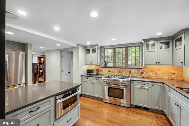 410 Arthurs Round Table, Wynnewood, PA 19096 - kitchen featuring appliances with stainless steel finishes, dark countertops, backsplash, and recessed lighting