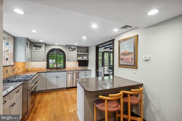 410 Arthurs Round Table, Wynnewood, PA 19096 - kitchen with stainless steel appliances, light wood finished floors, decorative backsplash, plenty of natural light, and recessed lighting
