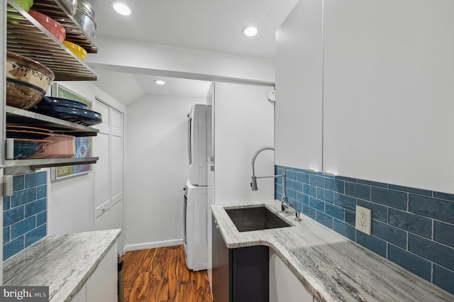 410 Arthurs Round Table, Wynnewood, PA 19096 - laundry area featuring dark wood finished floors, estacked washer and dryer, recessed lighting, and baseboards