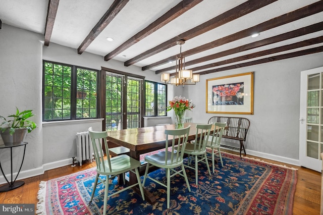 410 Arthurs Round Table, Wynnewood, PA 19096 - dining area with beam ceiling, radiator heating unit, baseboards, a chandelier, and wood finished floors