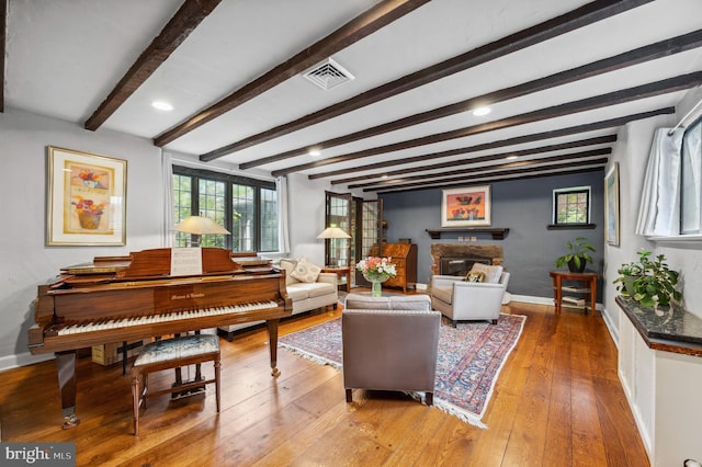 410 Arthurs Round Table, Wynnewood, PA 19096 - living room featuring a fireplace, baseboards, hardwood / wood-style flooring, plenty of natural light, and beamed ceiling