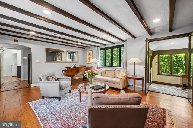 410 Arthurs Round Table, Wynnewood, PA 19096 - living area with baseboards, hardwood / wood-style flooring, beam ceiling, arched walkways, and recessed lighting