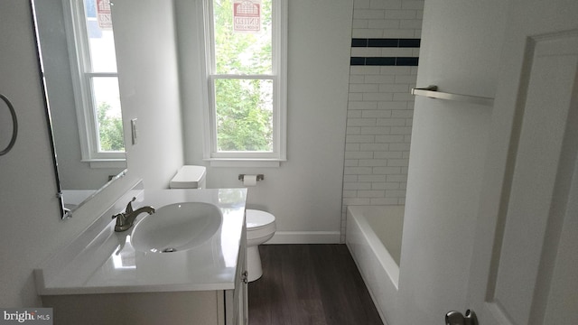 313 Park St, Waynesboro, PA 17268 - full bathroom featuring toilet, vanity, wood finished floors, and baseboards