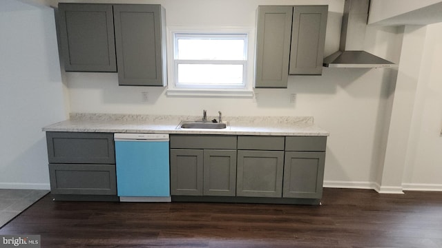 313 Park St, Waynesboro, PA 17268 - kitchen with dishwashing machine, wall chimney range hood, and gray cabinetry