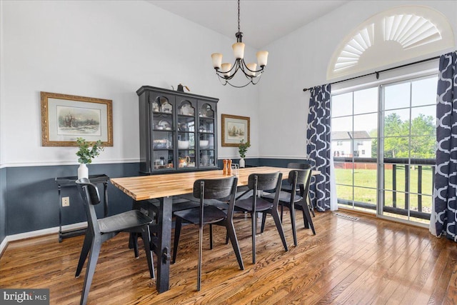 dining room featuring a chandelier and hardwood / wood-style floors