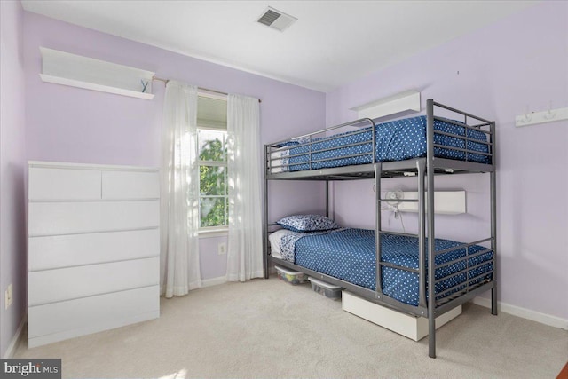 bedroom with carpet flooring and baseboards