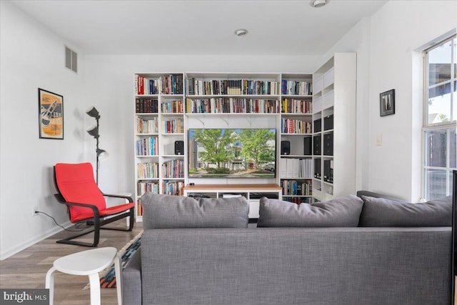 sitting room with wood finished floors and baseboards