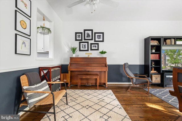 living area featuring wood finished floors and ceiling fan