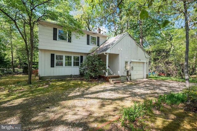 colonial house featuring a garage and driveway