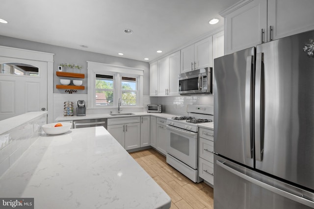 355 Agabiti Ct, Hamilton, NJ 08610 - kitchen featuring appliances with stainless steel finishes, a sink, open shelves, tasteful backsplash, and recessed lighting