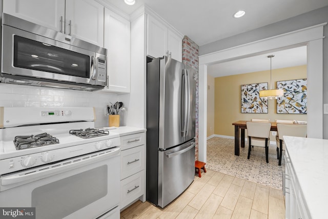 355 Agabiti Ct, Hamilton, NJ 08610 - kitchen featuring stainless steel appliances, light countertops, white cabinets, tasteful backsplash, and recessed lighting