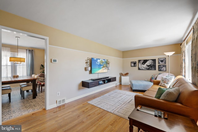 355 Agabiti Ct, Hamilton, NJ 08610 - living area with healthy amount of natural light, light wood-type flooring, and baseboards
