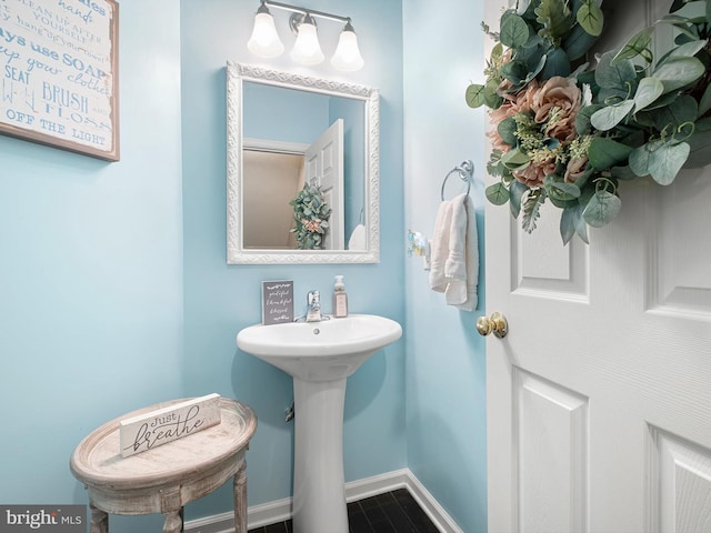 1390 Parish Ave, Claymont, DE 19703 - bathroom with baseboards and a sink