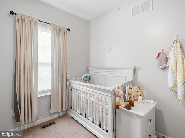 1390 Parish Ave, Claymont, DE 19703 - bedroom featuring a nursery area and light carpet