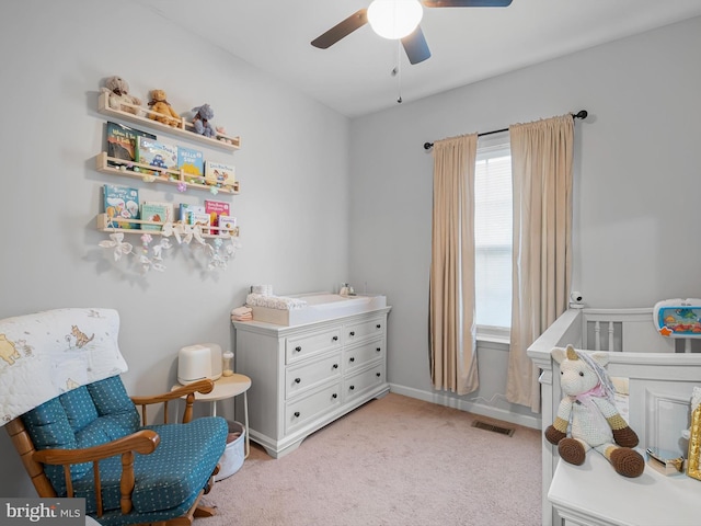 1390 Parish Ave, Claymont, DE 19703 - bedroom featuring light colored carpet, a nursery area, and a ceiling fan