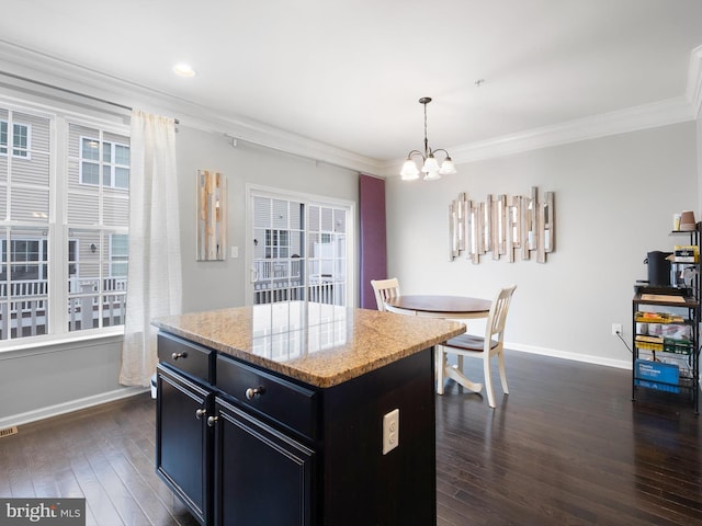 1390 Parish Ave, Claymont, DE 19703 - kitchen featuring dark cabinets, a chandelier, dark wood-style flooring, baseboards, and crown molding
