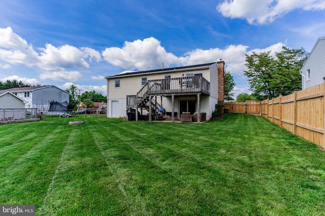 rear view of property featuring a trampoline, stairway, a deck, a chimney, and central AC