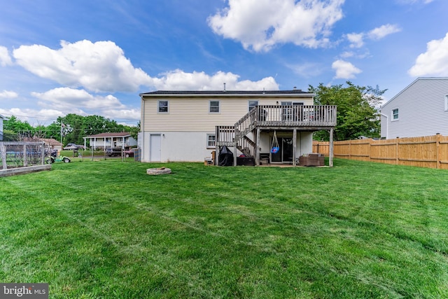 back of property with stairway and a deck