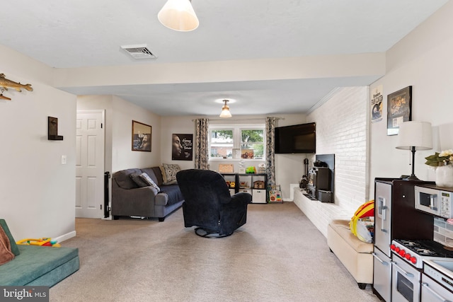 living room with light carpet and baseboards