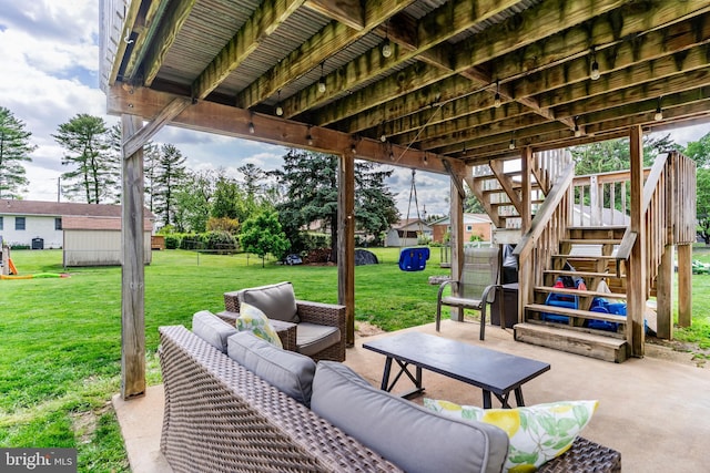 view of patio / terrace with stairs and an outdoor living space