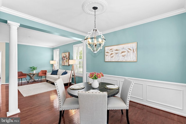 43127 Rocks Way, Leesburg, VA 20176 - dining room featuring crown molding, wood finished floors, a chandelier, ornate columns, and wainscoting