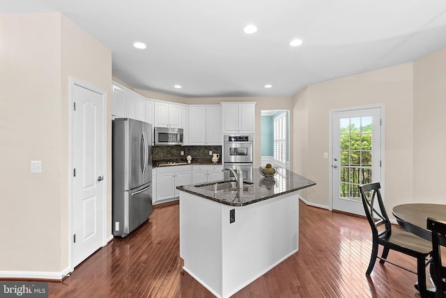 43127 Rocks Way, Leesburg, VA 20176 - kitchen featuring appliances with stainless steel finishes, a sink, dark wood-style floors, white cabinets, and recessed lighting