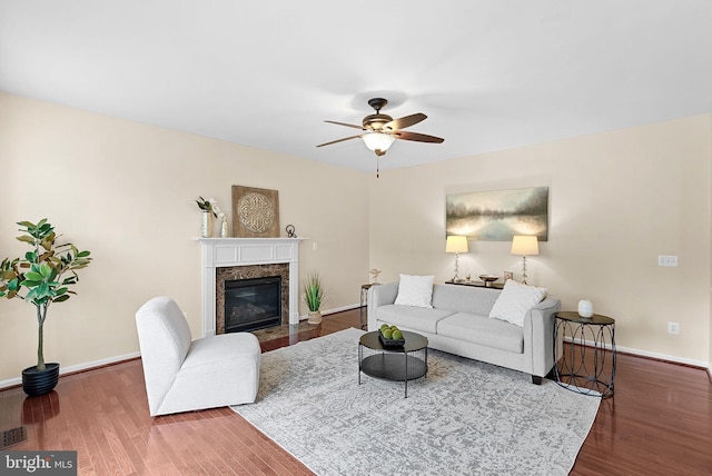 43127 Rocks Way, Leesburg, VA 20176 - living area featuring a ceiling fan, baseboards, wood finished floors, and a high end fireplace