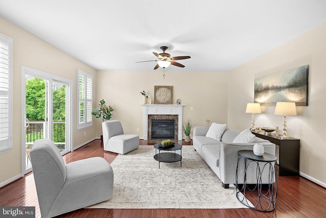 43127 Rocks Way, Leesburg, VA 20176 - living room featuring a ceiling fan, wood finished floors, a high end fireplace, and baseboards