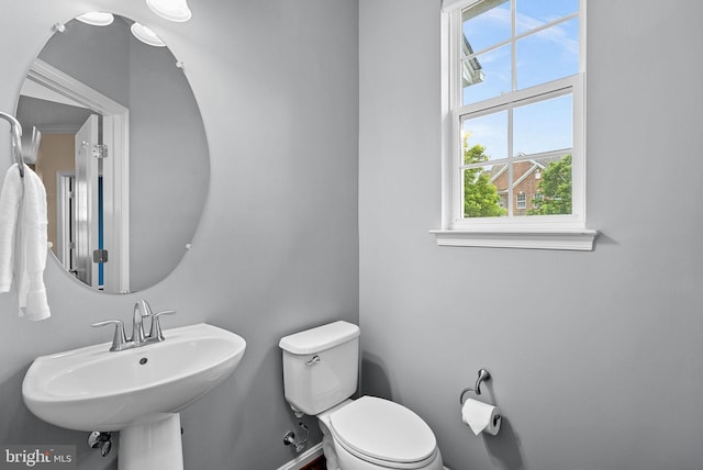 43127 Rocks Way, Leesburg, VA 20176 - bathroom with toilet, a sink, and baseboards