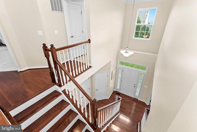 43127 Rocks Way, Leesburg, VA 20176 - staircase with wood finished floors, baseboards, and a high ceiling