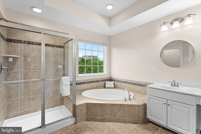 43127 Rocks Way, Leesburg, VA 20176 - bathroom with tile patterned floors, a shower stall, a garden tub, vanity, and recessed lighting