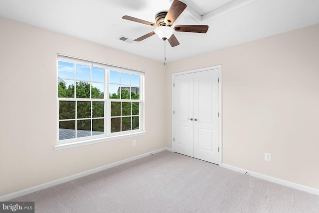 43127 Rocks Way, Leesburg, VA 20176 - unfurnished bedroom featuring baseboards, light colored carpet, a closet, and a ceiling fan