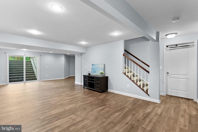 43127 Rocks Way, Leesburg, VA 20176 - unfurnished living room featuring wood finished floors, stairs, baseboards, and recessed lighting
