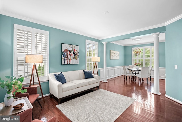 43127 Rocks Way, Leesburg, VA 20176 - living area featuring ornate columns, crown molding, a chandelier, wainscoting, and wood finished floors