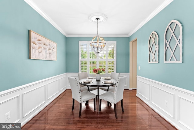 43127 Rocks Way, Leesburg, VA 20176 - dining space featuring a decorative wall, a chandelier, crown molding, a wainscoted wall, and wood finished floors