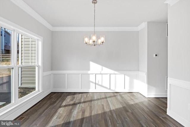 6741 Ginseng Ln, King George, VA 22485 - unfurnished dining area with a chandelier, wood finished floors, ornamental molding, and a wainscoted wall