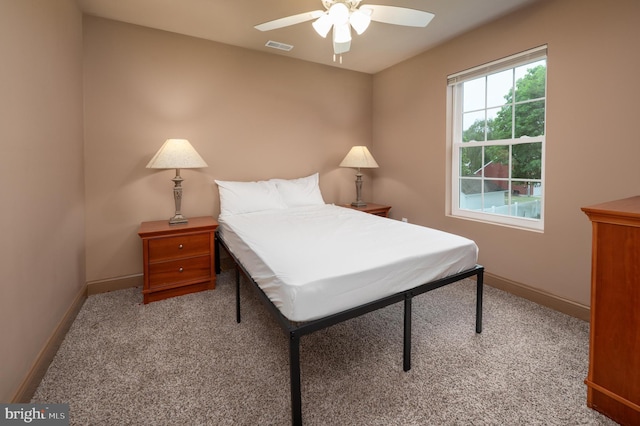 bedroom featuring carpet flooring, baseboards, and ceiling fan